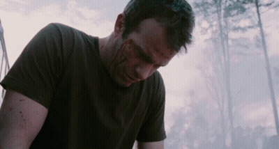 A Man With Blood On His Face Is Wearing A Black T-Shirt GIF