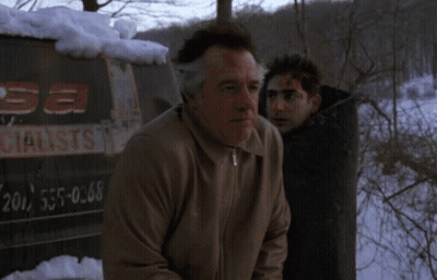 A Man With Blood On His Face Stands Next To Another Man In Front Of A Sign That Says " Sa Specialist " GIF