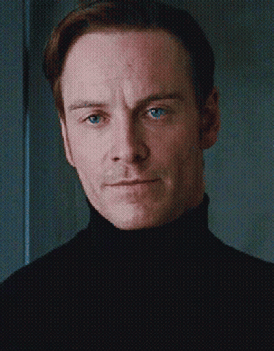 A Man With Blue Eyes And A Black Turtleneck GIF