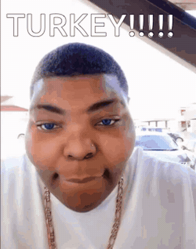 A Man With Blue Eyes And A Nose Ring Is Making A Funny Face . GIF
