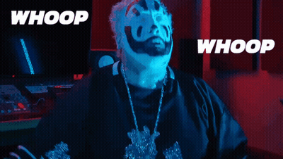 A Man With Blue Face Paint And A Necklace With The Words Whoop On The Bottom GIF