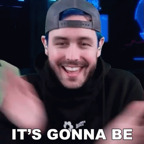 A Man With Blue Hair And A Hat Is Smiling And Says It 'S Gonna Be . GIF