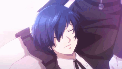 A Man With Blue Hair Is Laying On A Bed With His Eyes Closed GIF