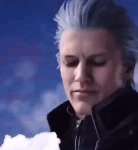 A Man With Blue Hair Is Standing In Front Of A Blue Sky . GIF