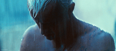 A Man With Blue Hair Is Taking A Shower In A Dark Room With A Watermark That Says Zuorin GIF