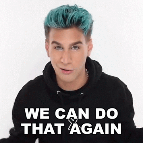 A Man With Blue Hair Is Wearing A Black Hoodie And Saying We Can Do That Again . GIF
