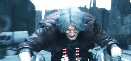 A Man With Blue Hair Is Wearing A Leather Jacket And Gloves While Riding A Motorcycle GIF