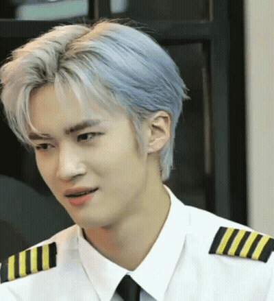 A Man With Blue Hair Is Wearing A White Shirt And Black Tie GIF