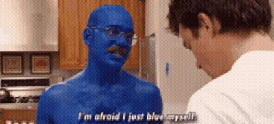 A Man With Blue Paint On His Body Is Talking To Another Man In A Kitchen . GIF