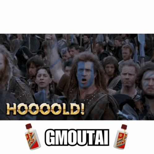 A Man With Blue Paint On His Face Stands In Front Of A Crowd And Says Hooooold Gmoutai GIF