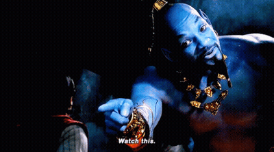 A Man With Blue Skin And Gold Jewelry Is Pointing At Someone And Says Watch This GIF