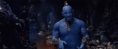 A Man With Blue Skin Is Sitting In A Cave . GIF
