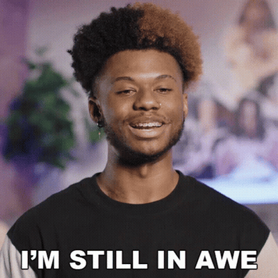 A Man With Braces On His Teeth Is Smiling And Says " I 'M Still In Awe " GIF