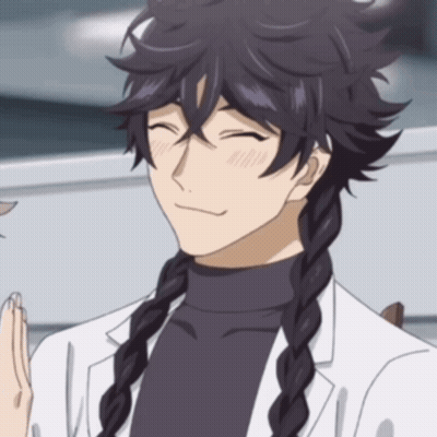 A Man With Braided Hair Is Wearing A White Coat And Black Turtleneck GIF