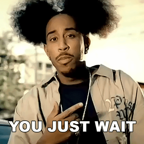 A Man With Curly Hair And A Beard Has The Words You Just Wait Written On His Face GIF