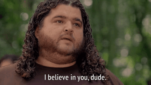 A Man With Curly Hair And A Beard Says " I Believe In You Dude " GIF
