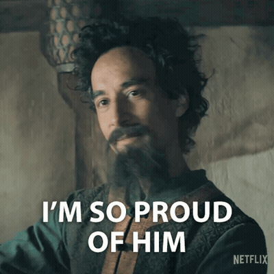 A Man With Curly Hair And A Beard Says " I 'M So Proud Of Him " GIF