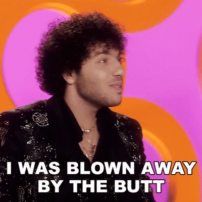 A Man With Curly Hair And A Beard Says I Was Blown Away By The Butt GIF
