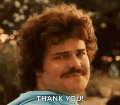 A Man With Curly Hair And A Mustache Is Giving A Thank You Gesture . GIF