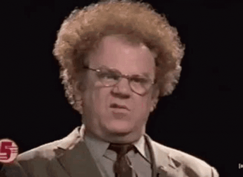 A Man With Curly Hair And Glasses Is Making A Funny Face . GIF