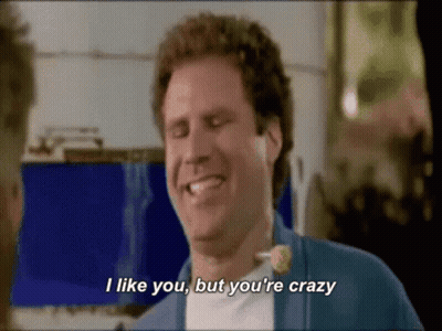 A Man With Curly Hair Is Smiling And Saying I Like You But You 'Re Crazy . GIF