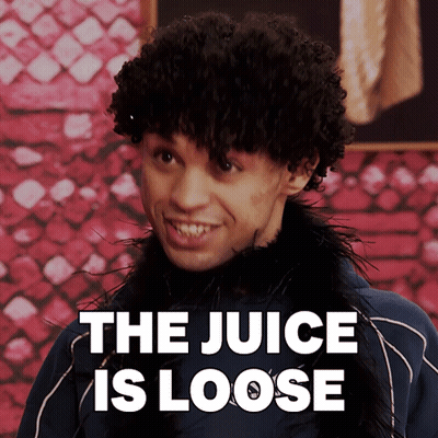 A Man With Curly Hair Is Smiling With The Words " The Juice Is Loose " Behind Him GIF