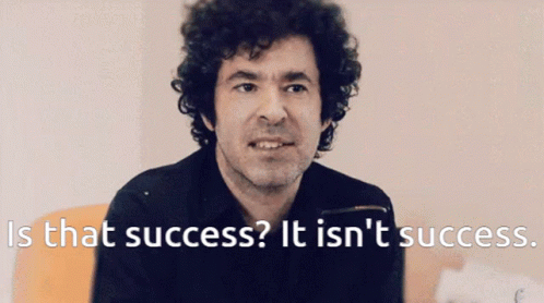 A Man With Curly Hair Says " Is That Success " GIF