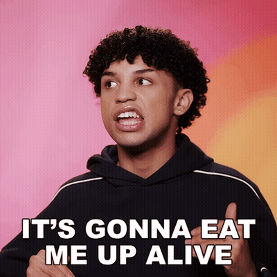 A Man With Curly Hair Says " It 'S Gonna Eat Me Up Alive " In Front Of A Pink Background GIF