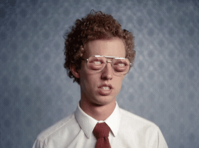 A Man With Curly Hair Wearing Glasses And A Red Tie GIF