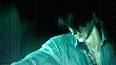 A Man With Dark Hair And A White Shirt Looks Down GIF