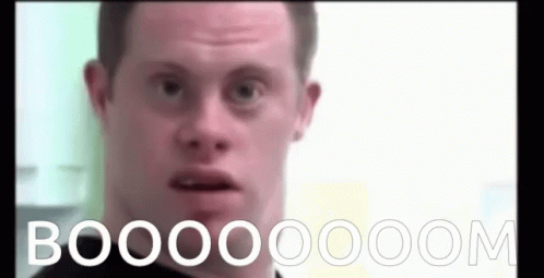 A Man With Down Syndrome Is Making A Funny Face And The Words Booooom Are Written On The Screen Behind Him . GIF