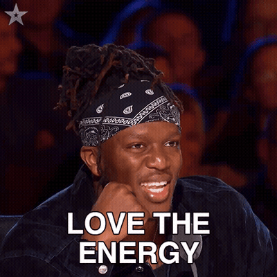 A Man With Dreadlocks And A Bandana On His Head Is Smiling With The Words Love The Energy Below Him GIF