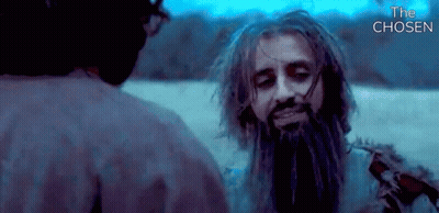 A Man With Dreadlocks And A Beard Is Talking To Another Man In A Movie Called The Chosen GIF