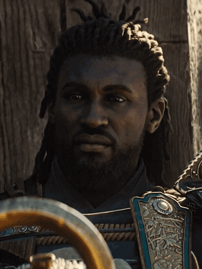 A Man With Dreadlocks And A Beard Is Wearing Armor GIF