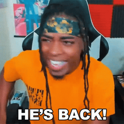 A Man With Dreadlocks And A Headband Is Smiling And Saying He 'S Back GIF