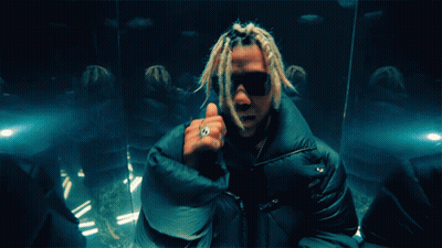 A Man With Dreadlocks And A Ring On His Finger Giving A Thumbs Up GIF