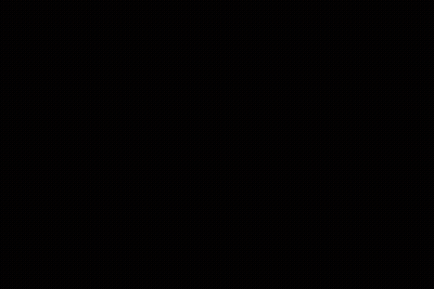 A Man With Dreadlocks And A White Shirt Is Kneeling Down GIF