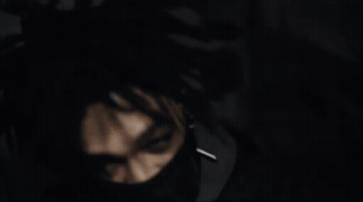 A Man With Dreadlocks And Black Nails Is Making A Middle Finger Gesture GIF
