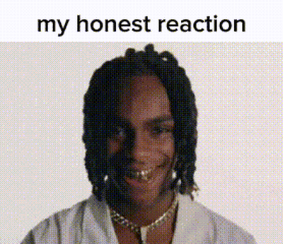 A Man With Dreadlocks And Gold Teeth Is Smiling With The Words `` My Honest Reaction '' Above Him . GIF