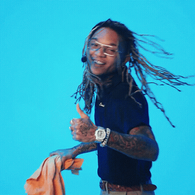 A Man With Dreadlocks Giving A Thumbs Up Sign GIF