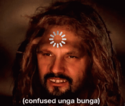 A Man With Dreadlocks Has A Loading Circle On His Forehead And The Words Confused Unga Bunga On The Bottom GIF