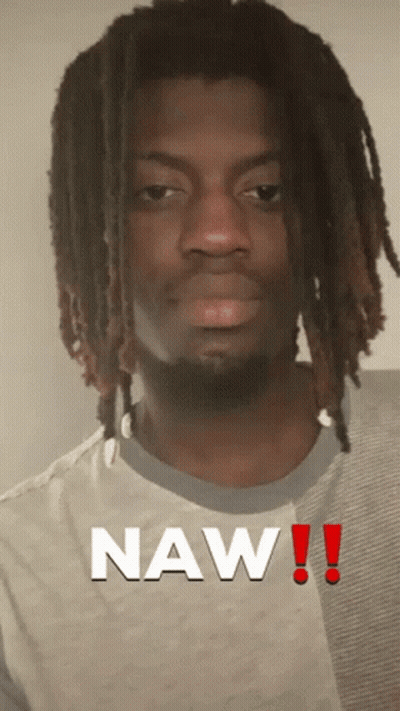 A Man With Dreadlocks Has The Word Naw Written On His Shirt GIF