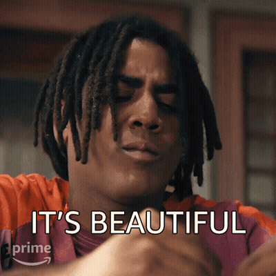 A Man With Dreadlocks Has The Words " It 'S Beautiful " Written On His Face GIF