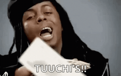 A Man With Dreadlocks Is Holding A Bunch Of Money In His Hands And Shouting . GIF