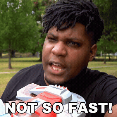 A Man With Dreadlocks Is Holding A Toy Gun And Says Not So Fast GIF