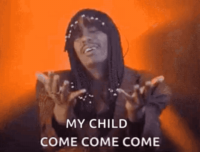 A Man With Dreadlocks Is Holding His Hands Up In The Air And Says `` My Child Come Come Come '' . GIF