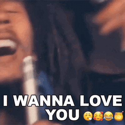 A Man With Dreadlocks Is Laughing With The Words I Wanna Love You GIF
