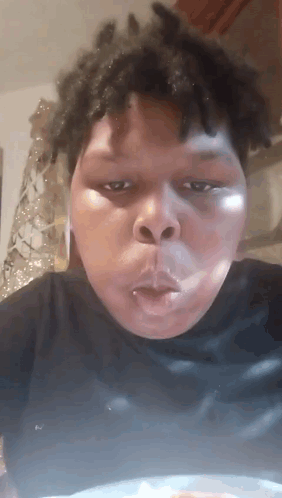 A Man With Dreadlocks Is Making A Funny Face GIF