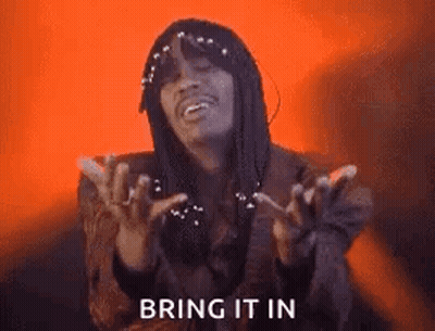 A Man With Dreadlocks Is Making A Funny Face With His Hands In The Air . GIF