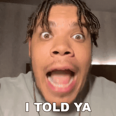 A Man With Dreadlocks Is Making A Funny Face With The Words I Told Ya Behind Him GIF